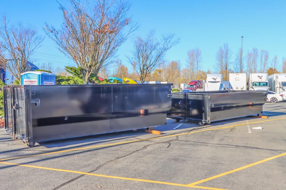 Professional dumpster rental service with roll-off container on residential driveway in Mountlake Terrace